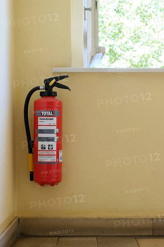 Berlin, Germany, June 23, 2024, Fire extinguisher in the stairwell of a residential building, Europe