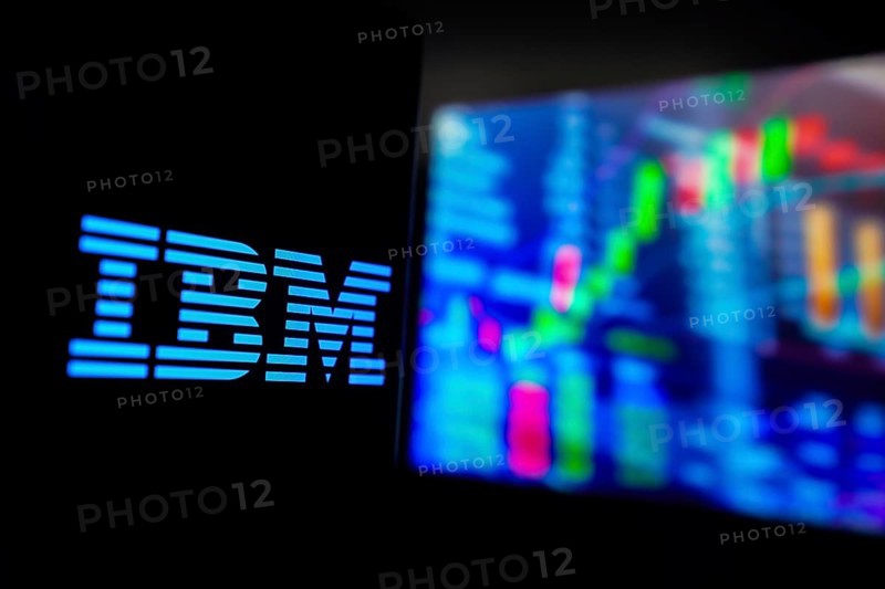March 15, 2024, Brazil. In this photo illustration, the International Business Machines Corporation (IBM) logo is displayed on a smartphone screen, with graphic representation of the stock market in the background