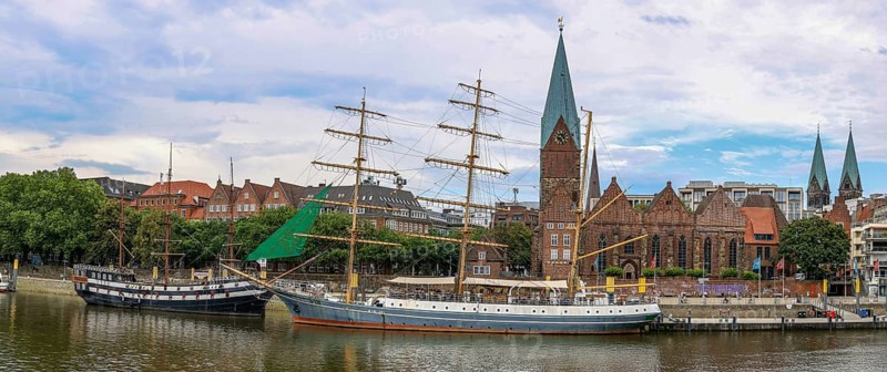 Panoramic photo of the promenade on the Weser with the sailing ship restaurants Dreimaster Alexander von Humboldt and Admiral Nelson and in the background St. Martini Church, Old Town Bremen, Hanseatic City of Bremen, Germany, Europe