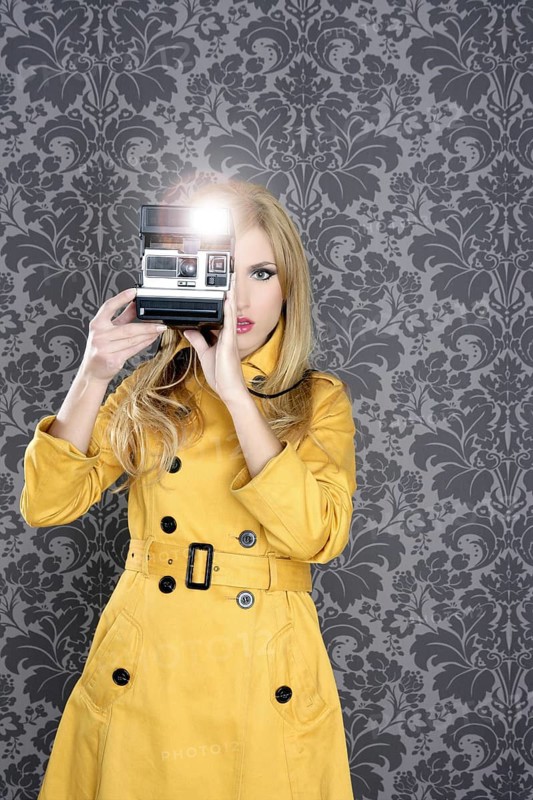 Fashion photographer retro camera reporter woman vintage wallpaper yellow coat