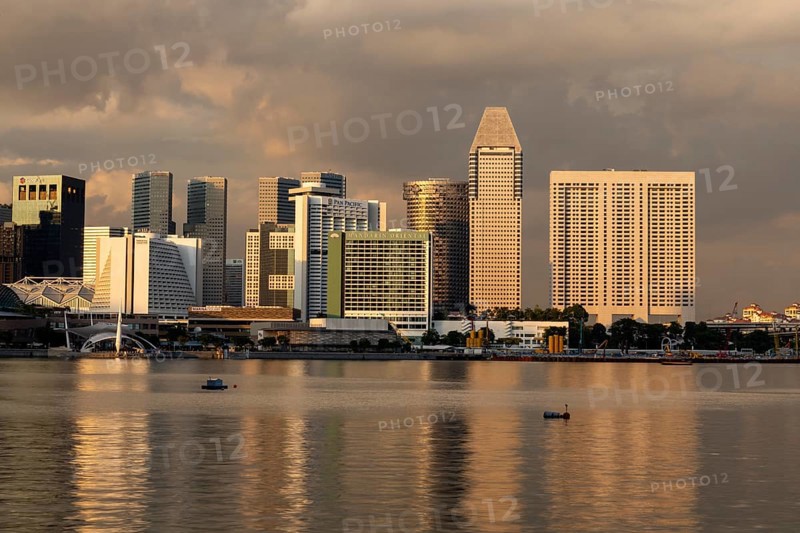 Skyline at sunset with Pan Pacific skyscraper and Mandarin Oriental Hotel, Marina Bay, Singapore, Singapore, Asia