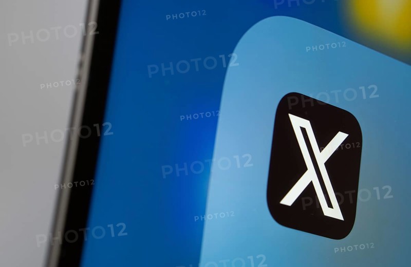 A close up of an iPad screen displaying the X (twitter) app