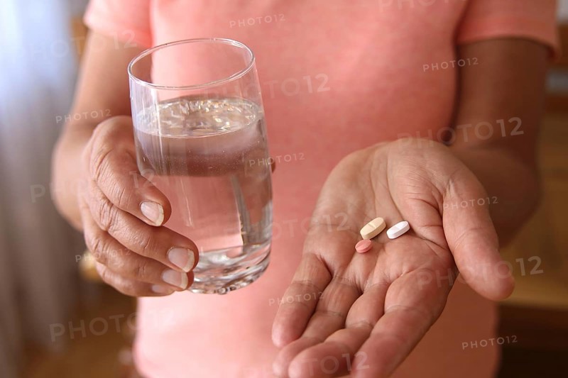 Woman accepts medicine