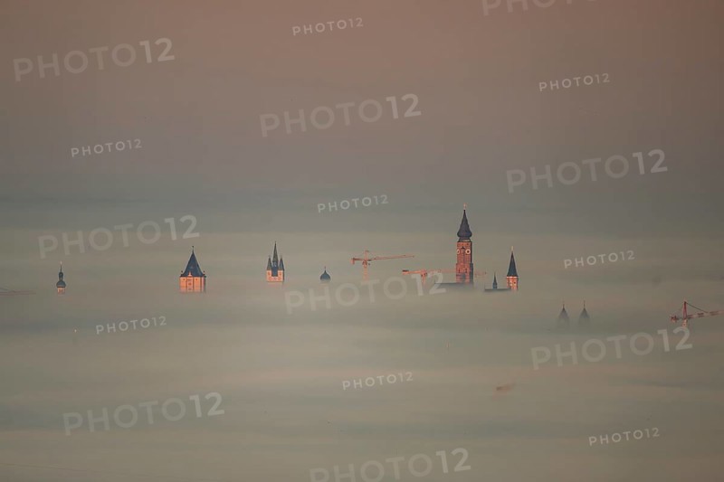 The towers of the town of Straubing (Lower Bavaria) in the morning mist