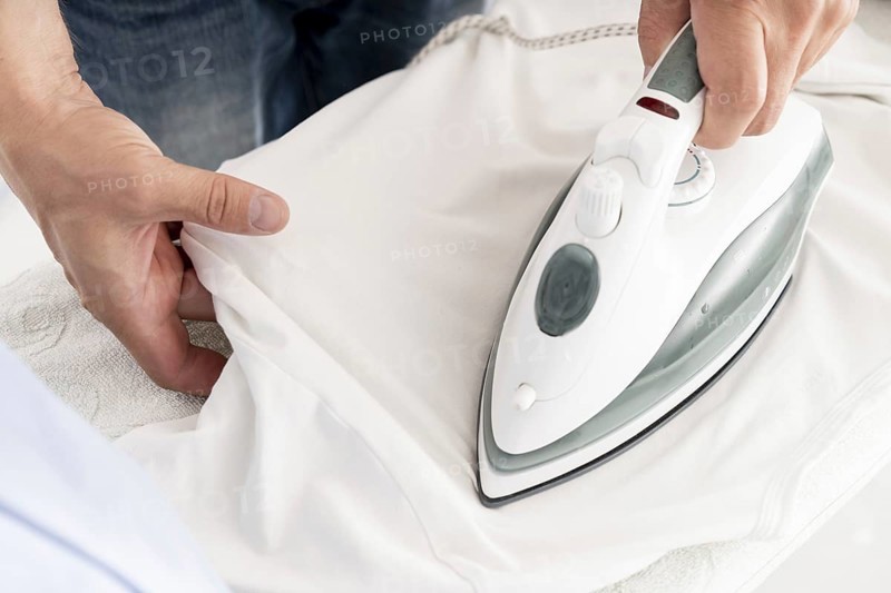 Man ironing clothes close up. Resolution and high quality beautiful photo