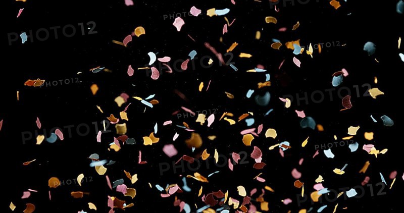Confettis Falling against Black Background