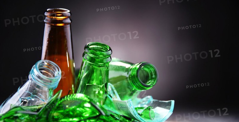 Broken glass bottles and pieces of glass. Recycling