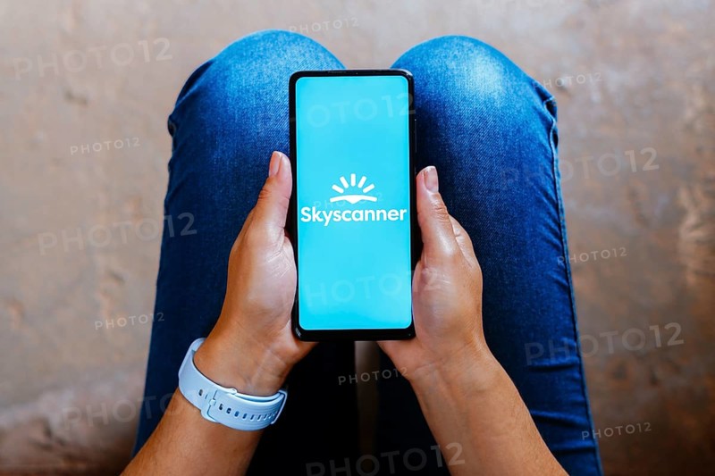 In this photo illustration, the Skyscanner logo is displayed on a smartphone screen