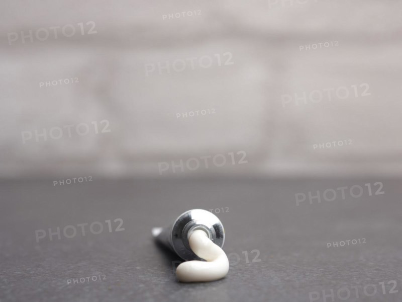 Close up of a cream tube on a bathroom table