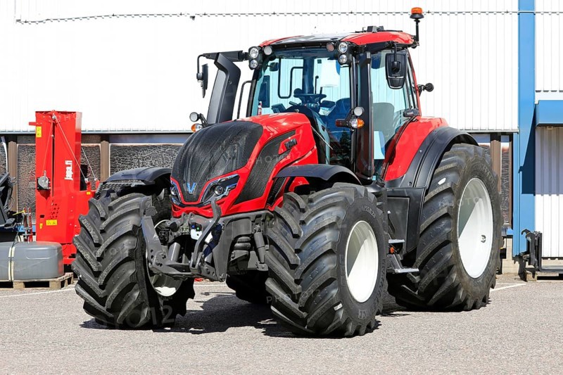 Red Valtra T235 tractor parked outside at the AGCO agricultural machinery dealership. Salo, Finland. June 22, 2024