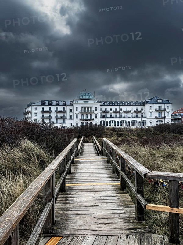 Dramatic clouds over the spa hotel on Juist, East Frisian Islands, Germany, Europe