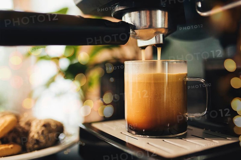 Cup of coffee at the coffee maker, coffee time.