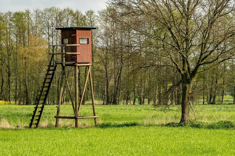 High stand for hunters in the meadow