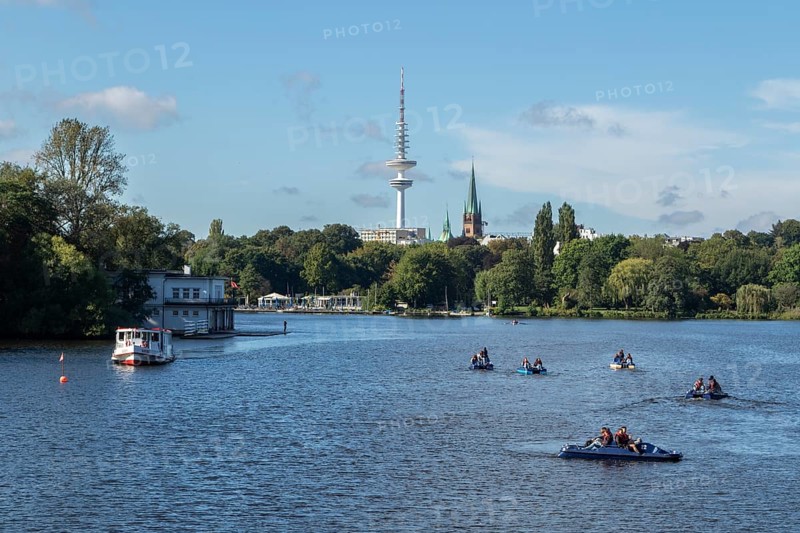 Leisure activities in summer, pedal boats and Alster-Touristik barge Susebek in front of a blue sky on the Alster, behind it the television tower Telemichel, Hamburg, Germany, Europe