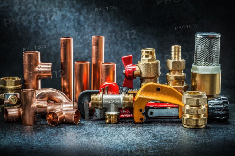 Pipe cutter and adjustable wrench with brass copper connectors big set on dark background