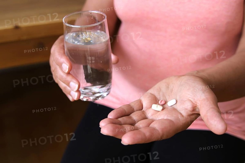 Woman accepts medicine