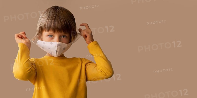 Boy wearing medical mask with copy space