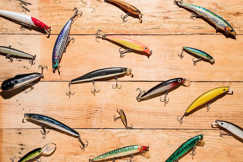 Colorful fishing lures wooden desk