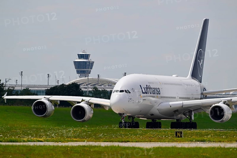 Lufthansa Airbus A380-800 with control tower taxiing from Terminal 2 to Runway North, Munich Airport, Upper Bavaria, Bavaria, Germany, Europe