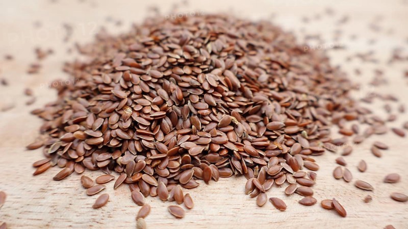 Macro Shot of Flaxseeds (Linseeds), Isolated, Food, Rustic Wooden Surface