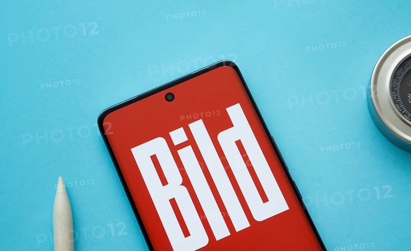 The logo of the German newspaper Bild is displayed on a smartphone screen