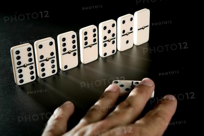Domino game business metaphor of choosing the right way