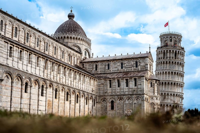 Historic architecture with the Leaning Tower of Pisa under a blue sky, Pisa, Italy, Europe