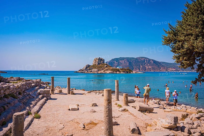 Ancient ruins on the shore with a view of the sea and a rocky island in the background, Agios Stefanos, Kos Island, Greece, Europe