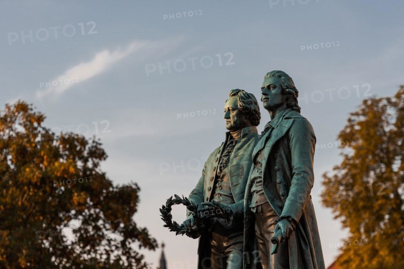 Goethe-Schiller Monument in Weimar in the morning sunlight under a blue sky