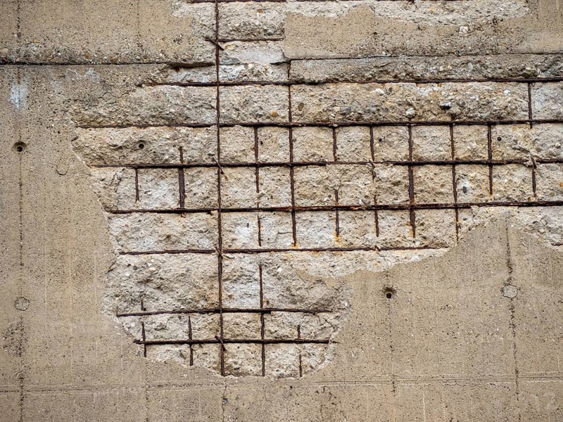 Old wall background with concrete and rusty metal
