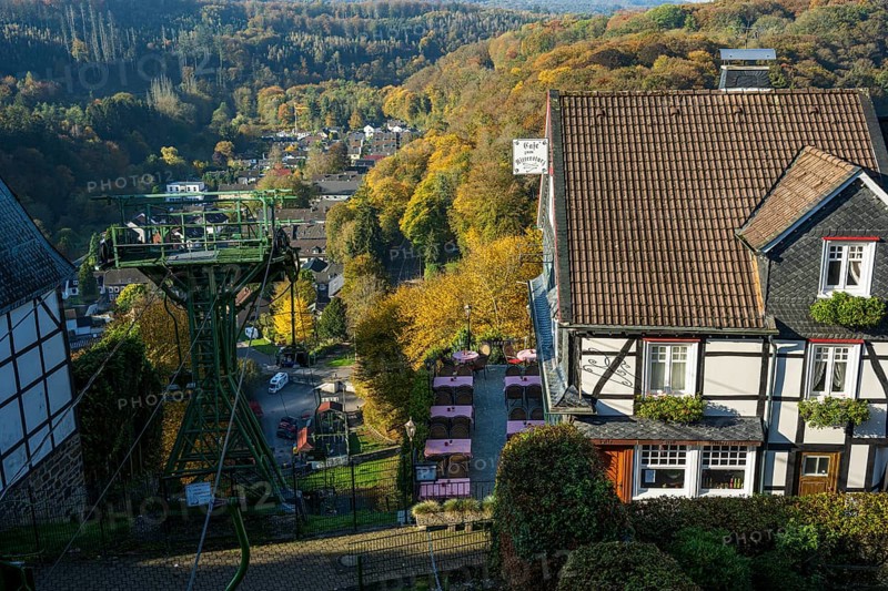 Autumn landscape with a view of a cable car and traditional village architecture, Burg Castle in Bergisches Land