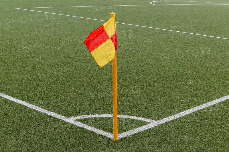 Corner of a ball soccer field wwith pile and flag