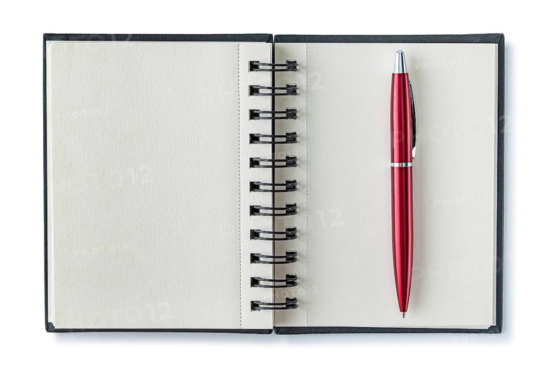 Opened Notepad With Red Ballpoint Pen Isolated