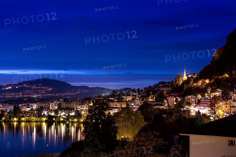 Switzerland, Montreux, cityscape dusk night view with Lake Geneva and Alps, Europe