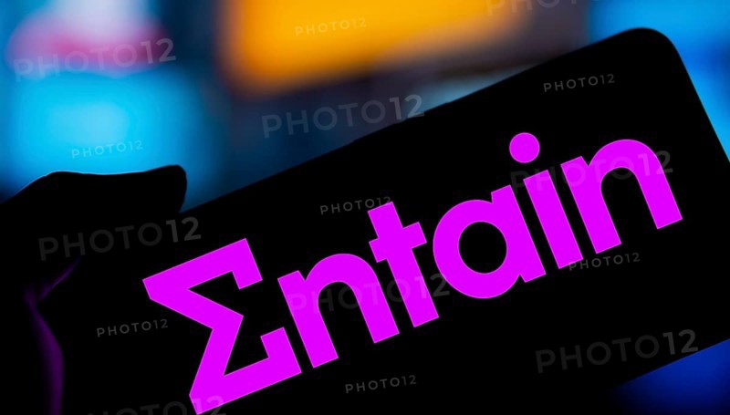 Dhaka, Bangladesh- 28 Nov 2024: Entain logo is displayed on smartphone.Entain plc is an international sports betting and gambling company