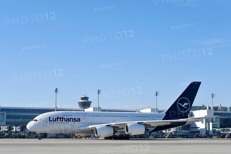 Lufthansa Airbus A380-800 with control tower, taxiing in front of Terminal 2 to runway South Terminal 2, Munich Airport, Upper Bavaria, Bavaria, Germany, Europe