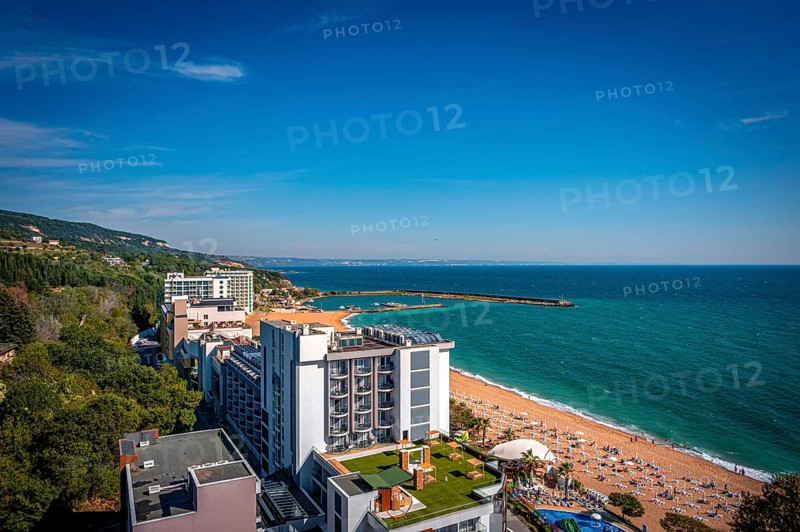 View of a hotel on the beach overlooking the Black Sea under a blue sky, Golden Sands, Varna, Bulgaria, Europe