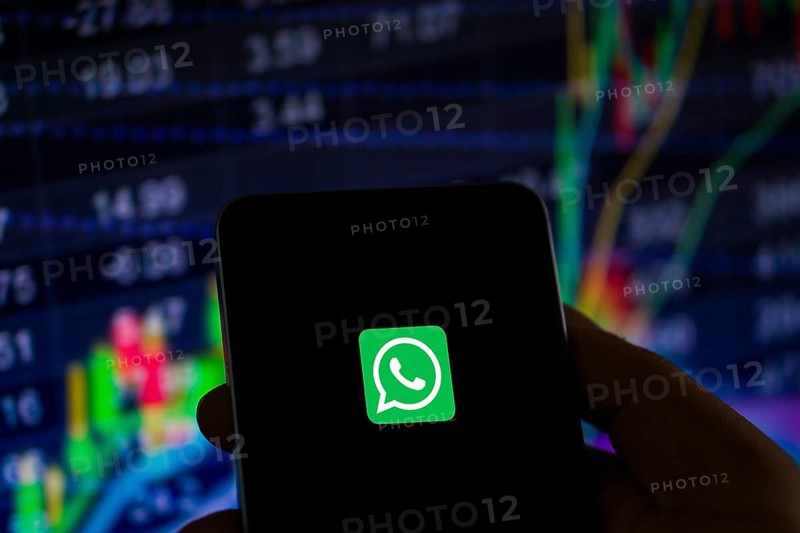 Man holding a cellphone with WhatsApp on the screen.Dhaka, Bangladesh- 09 September 2024.