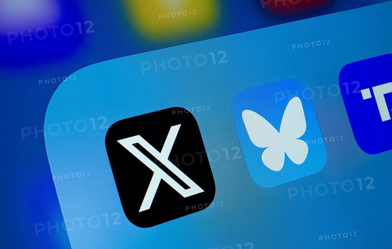 A close up of an iPad screen displaying the X, Bluesky and Truth Social app