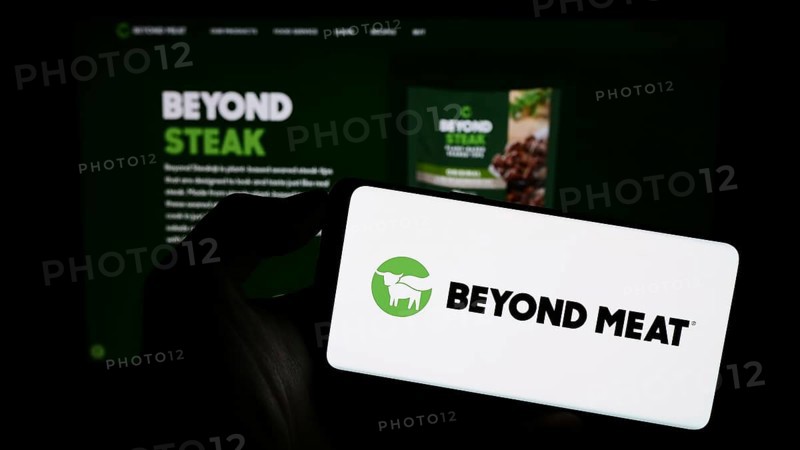 Stuttgart, Germany, 09-11-2023: Person holding mobile phone with logo of American meat substitute company Beyond Meat Inc. on screen in front of web page. Focus on phone display, Europe