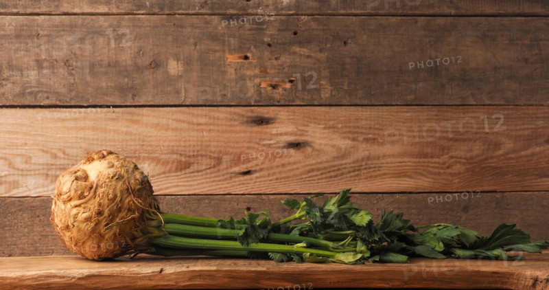 Organic celeriac on a rustic wooden table, healthy food, space for your text, organic ingredients, vegetarian or vegan food