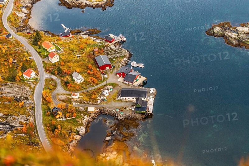 Aerial view of a small island village surrounded by a vibrant autumn landscape, mountains, rocks, road, sea, ocean, water, nature, couds, vilage, Lofoten Islands, Norway, Norge, Europe