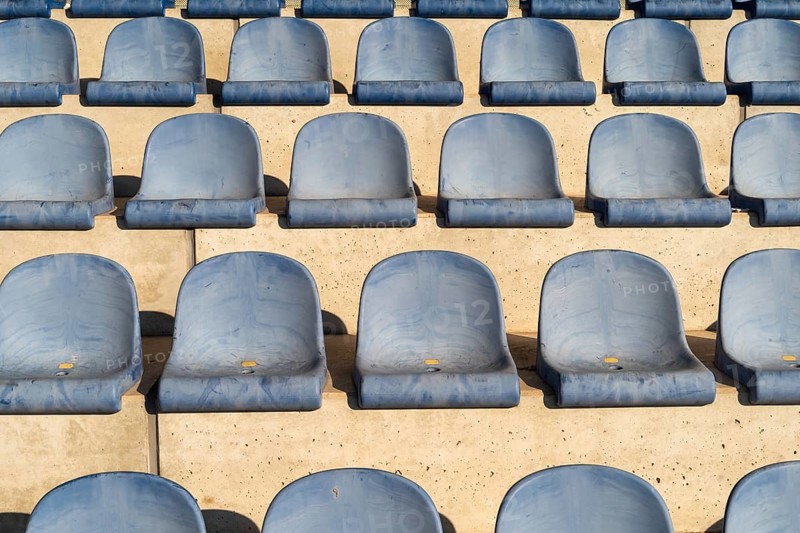 Rows with blue seat shells on a sports stand