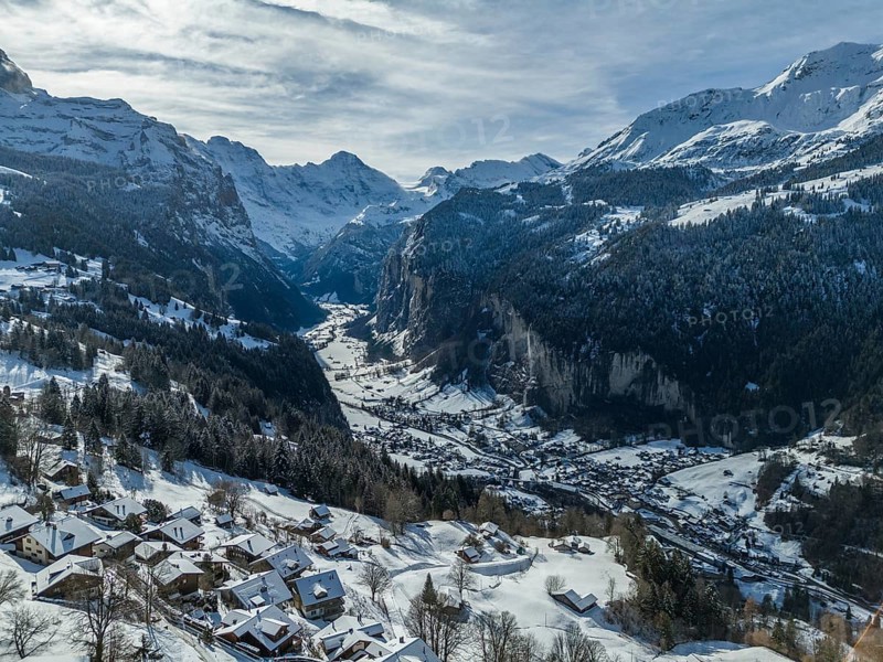Lauterbrunnen Valley and Snowy Mountains on Sunny Winter Day. Swiss Alps. Switzerland. Aerial View. View from Wengen