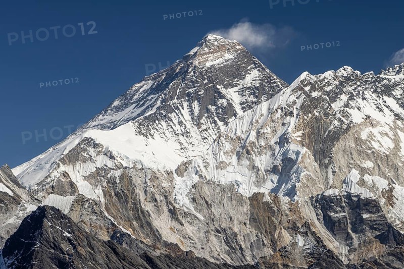 Mount Everest as seen from Renjo La, the mountain pass above Gokyo in Khumbu, the Everest Region. South Summit on the Southeast Ridge, West Ridge, North Face, Southwest Face of Everest can be recognised, and Nuptse is to the right of the highest mountain.Photographed on a clear, blue sky, autumn day. Three Passes Trek, post-monsoon trekking season. Sagarmatha National Park, UNESCO World Heritage Site. Solukhumbu, Koshi Province, Nepal, Asia