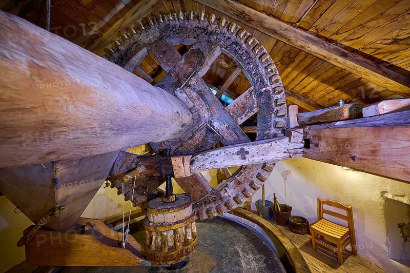 Interior view with wooden mill wheel in a rustic attic, Kefalos, Kos, Dodecanese, Greek Islands, Greece, Europe
