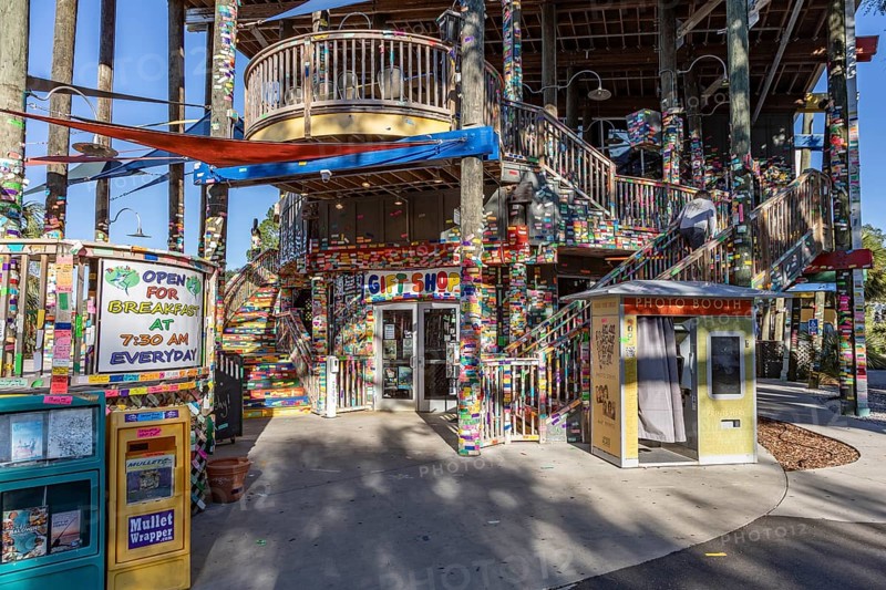 Tacky Jacks bar and restaurant decorated with strips of brightly colored stickers where guests write names or messages in Gulf Shores, Alabama