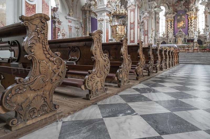 Artfully carved cheeks of the church pews in the collegiate basilica, Neustift St Margarethen, Vahrn, district of Bozen, South Tyrol, Italy, Europe