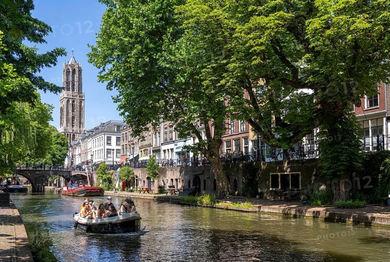 The old town centre of Utrecht, Oudegracht, around 2 km long with many old houses, cathedral tower, highest church tower in the Netherlands, newly renovated, shops, restaurants directly on the canal, many bridges, boat traffic of all kinds, canal tour, Netherlands