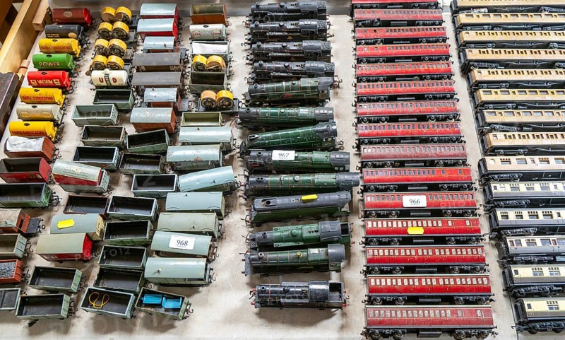 Model railway toy train set items on display for sale at auction room, UK